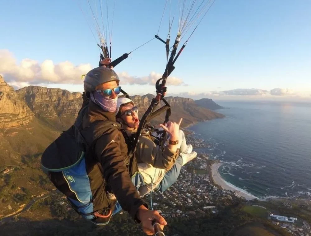 Paragliding from Signal Hill Mountain to Sea Point Promenade Experience tandem paragliding from Signal Hill to the Sea Point Promenade, near EIGHTY2 ON M. Enjoy scenic views and an unforgettable adventure!