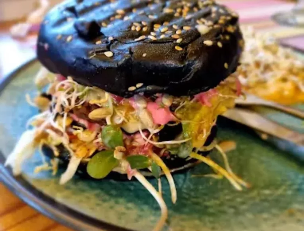 Sunshine Food Sprouting Co African Vegan Café Discover plant-based goodness at Sunshine Food Sprouting Co, a short walk from EIGHTY2 ON M. Enjoy fresh, all-you-can-eat vegan dishes with an ocean breeze.